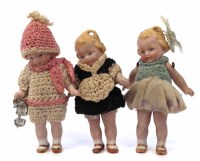Lot 19 - Three dolls including skater.
