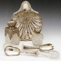 Lot 166 - Silver shell dish; salad servers; two silver topped bottles