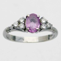 Lot 218 - 750 white gold ring set with an oval pink