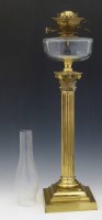 Lot 416 - Brass based oil lamp.