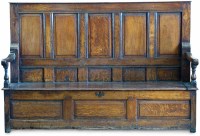 Lot 457 - George III oak settle.