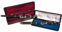 Lot 28 - Two piccolos with cases (1 original).