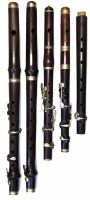 Lot 30 - Three small flutes and a piccolo.