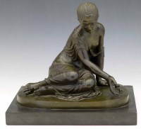 Lot 443 - Patinated bronze sitting figure