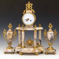 Lot 445 - Three piece clock garniture.