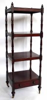 Lot 481 - George III mahogany four shelf what not
