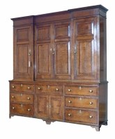 Lot 500 - George III oak breakfront housekeepers cupboard