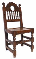 Lot 521 - 17th century oak back stool