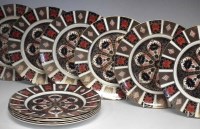 Lot 174 - Eleven Royal Crown Derby plates, decorated with