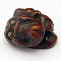 Lot 223 - Japanese ivory netsuke of three no masks