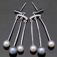 Lot 317 - Pair of white gold earrings set with pearls