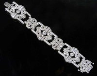 Lot 330 - Platinum and diamond paved bracelet.