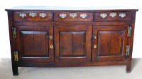 Lot 737 - George III oak closed dresser