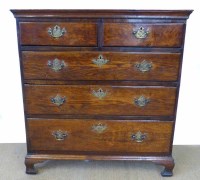Lot 743 - George III oak chest of two short and three long graduated drawers