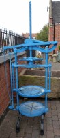 Lot 764 - Cast iron two tier cheese press on castors