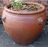 Lot 774 - Large brown glazed planter with lion mask