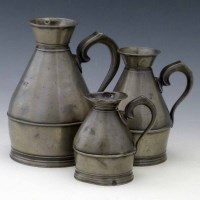 Lot 13 - Three Irish haystack measures.
