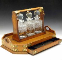 Lot 24 - Oak tantalus on tray base
