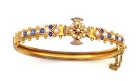 Lot 365 - Late Victorian split pearl and blue stone hinged bangle.
