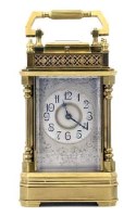 Lot 644 - Brass carriage clock with gallery.