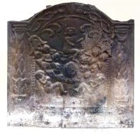 Lot 697 - Cast iron fire back decorated with figures amongst floral swags
