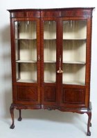 Lot 733 - Edwardian mahogany serpentine display cabinet