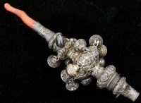 Lot 251 - Baby's silver rattle with red coral end