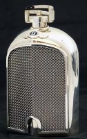 Lot 258 - Silver Bentley Le Mans spirit flask with bag