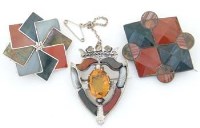 Lot 272 - Shield shaped cloak brooch and two others