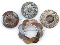Lot 274 - Four silver and hardstone cloak brooches