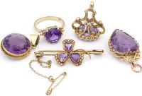 Lot 279 - Three amethyst brooches, ring , fob