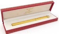 Lot 344 - Must de Cartier gold plated ball point pen in original case