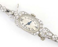 Lot 345 - Platinum and diamond lady's cocktail wristwatch