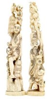 Lot 381 - Two Okimonos of men and children.