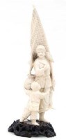 Lot 385 - Ivory standing figure of a fisherwoman