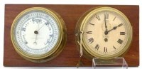 Lot 678 - Ship's brass bulkhead clock and barometer.