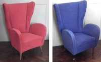 Lot 751 - Two 1950's upholstered wing armchairs,   in red