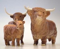 Lot 112 - Beswick Highland cow set.