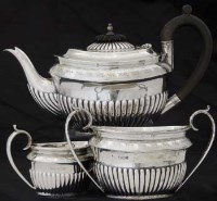 Lot 182 - Silver three piece tea set.