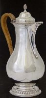 Lot 187 - Silver Georgian style baluster hot water jug.