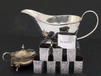 Lot 189 - Silver sauce boat, eight napkin rings, mustard