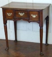 Lot 435 - George III oak lowboy.