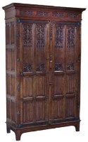 Lot 451 - Gothic revival oak wardrobe  with panelled doors