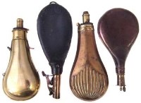 Lot 85 - Four powder flasks.