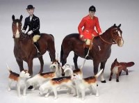 Lot 169 - Beswick huntsman and woman; six dogs and a fox.