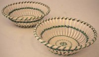 Lot 288 - Pair of creamware baskets,   with green enamelled