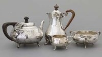 Lot 318 - Arts & Crafts silver four piece tea set.