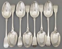 Lot 320 - Eight silver fiddle pattern tables spoons.