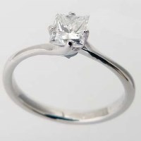 Lot 328 - White gold ring set with a princess diamond