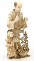 Lot 418 - Japanese ivory okimono of a man and boy